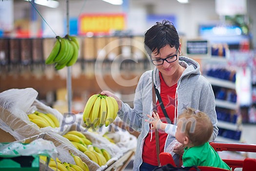 young mother with baby in shopping mall supermarket store buying food and grocery young mother with baby in shopping mall supermarket store buying food and grocery