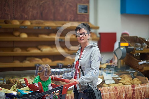 young mother with baby in shopping mall supermarket store buying food and grocery young mother with baby in shopping mall supermarket store buying food and grocery