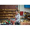 young mother with baby in shopping mall supermarket store buying food and grocery