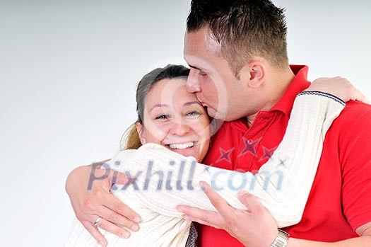 young family couple together in studio isolated on white. happy and waiting for baby young family couple together in studio isolated on white. happy and waiting for baby