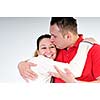 young family couple together in studio isolated on white. happy and waiting for baby