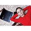 happy child school girl  relax at home with laptop computer in background