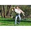 happy young romantic couple in love dance outdoor at spring season on early mornig with beautiful light