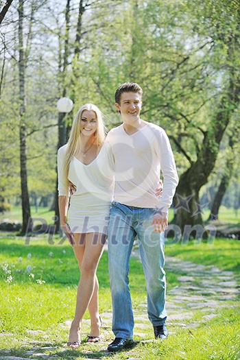 happy young romantic couple in love dance outdoor at spring season on early mornig with beautiful light happy young romantic couple in love dance outdoor at spring season on early mornig with beautiful light