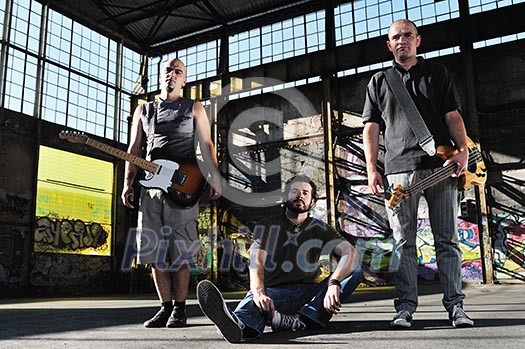 gorup of three man outdoor with music instruments representing urban and everyday city life scene gorup of three man outdoor with music instruments representing urban and everyday city life scene