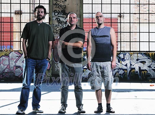 group of three adult man outdoor in the city at the sunset representing urban and modern everyday scene group of three adult man outdoor in the city at the sunset representing urban and modern everyday scene