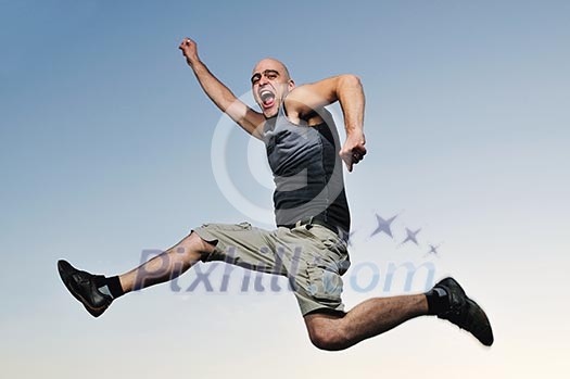 young man jumping in air at sunset outdoor young man jumping in air at sunset outdoor