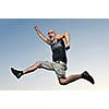 young man jumping in air at sunset outdoor