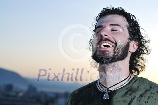 young man dring fresh water from bottle outdoor young man dring fresh water from bottle outdoor