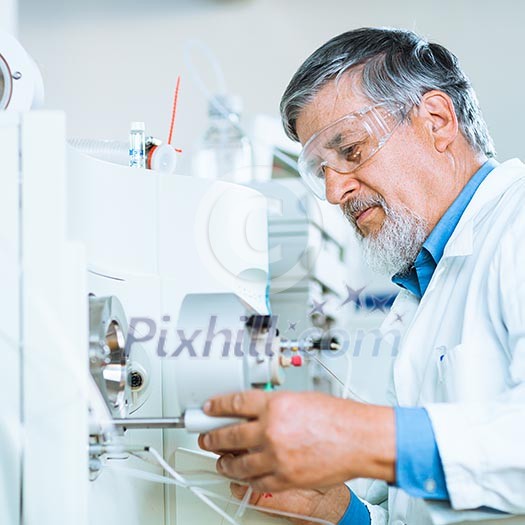 Senior male researcher carrying out scientific research in a lab (shallow DOF; color toned image) Senior male researcher carrying out scientific research in a lab (shallow DOF; color toned image)