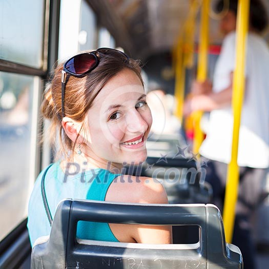 Pretty, young woman on a streetcar/tramway, during her commute to work/school (color toned image; shallow DOF) Pretty, young woman on a streetcar/tramway, during her commute to work/school (color toned image; shallow DOF)