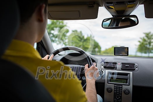 Man driving a car with his hands on the steering wheel Man driving a car with his hands on the steering wheel