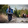 People hiking - goiing down a lovely alpine path