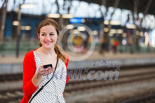 Pretty young woman at a train station Pretty young woman at a train station