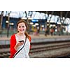 Pretty young woman at a train station
