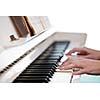 Playing Piano (shallow DOF; color toned image)