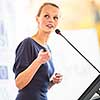 Pretty, young business woman giving a presentation in a conference/meeting setting (shallow DOF; color toned image)