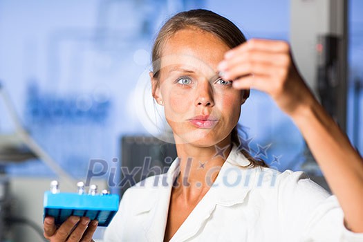 Portrait of a female researcher doing research in a lab (shallow DOF; color toned image) Portrait of a female researcher doing research in a lab (shallow DOF; color toned image)