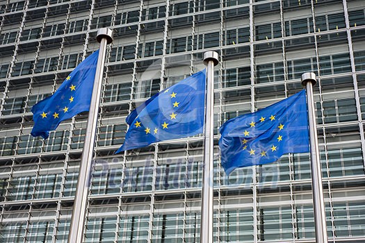 European Union flags in front of the Berlaymont building (European commission) in Brussels, Belgium. European Union flags in front of the Berlaymont building (European commission) in Brussels, Belgium.