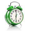 green old style alarm clock isolated on white