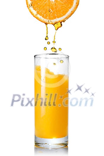 Pouring orange juice from orange into the glass isolated on white Pouring orange juice from orange into the glass isolated on white