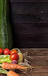 Fresh vegetables on a wooden table. Rustic style. Vegetarianism. Organic food. Space for text.