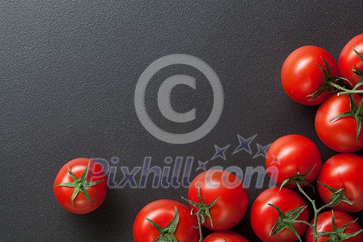 red tomatoes on black. top view red tomatoes on black. top view