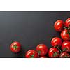 red tomatoes on black. top view