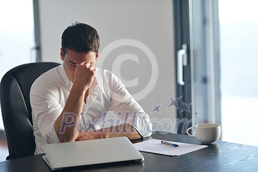 frustrated with problems young business man working on laptop computer at home frustrated with problems young business man working on laptop computer at home