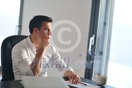 portrait of young happy business man working on laptop computer at home portrait of young happy business man working on laptop computer at home