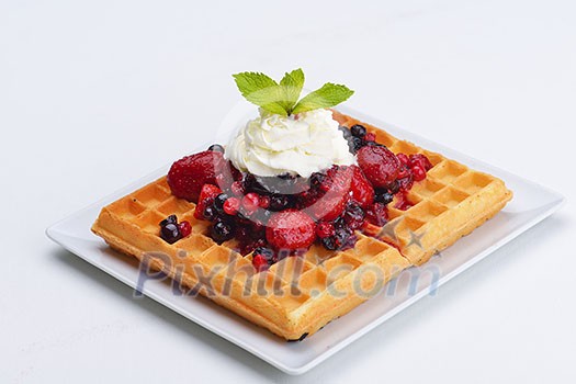 a selection of three italian gelato ice-cream scoops topped with nuts, chocolate, fruit served on crispy waffels a selection of three italian gelato ice-cream scoops topped with nuts, chocolate, fruit served on crispy waffels