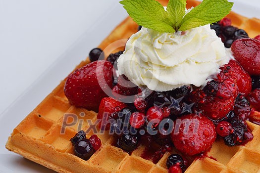 a selection of three italian gelato ice-cream scoops topped with nuts, chocolate, fruit served on crispy waffels a selection of three italian gelato ice-cream scoops topped with nuts, chocolate, fruit served on crispy waffels