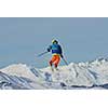 jumping skier at mountain winter snow fresh suny day