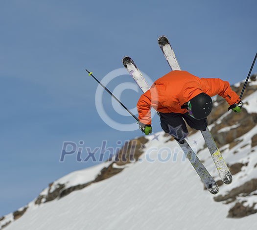 jumping skier at mountain winter snow fresh suny day jumping skier at mountain winter snow fresh suny day