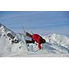 jumping skier at mountain winter snow fresh suny day