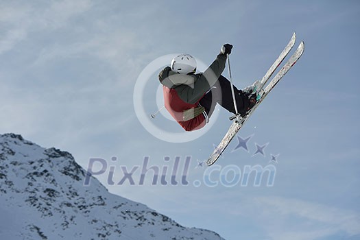jumping skier at mountain winter snow fresh suny day jumping skier at mountain winter snow fresh suny day