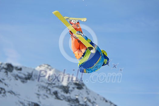 jumping skier at mountain winter snow fresh suny day jumping skier at mountain winter snow fresh suny day