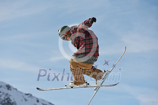 jumping skier at mountain winter snow fresh suny day jumping skier at mountain winter snow fresh suny day