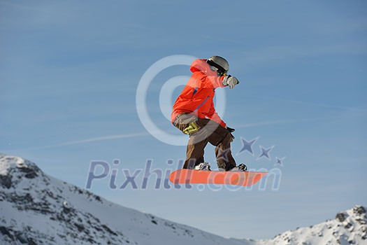 jumping skier at mountain winter snow fresh suny day jumping skier at mountain winter snow fresh suny day