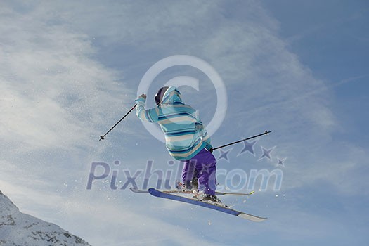 jumping skier at mountain winter snow fresh suny day