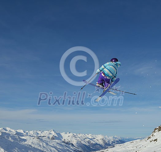 jumping skier at mountain winter snow fresh suny day jumping skier at mountain winter snow fresh suny day