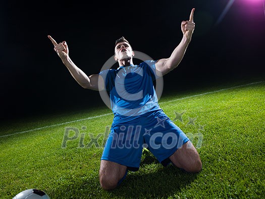 soccer player doing kick with ball on football stadium field isolated on black background soccer player doing kick with ball on football stadium field isolated on black background
