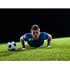 soccer player doing kick with ball on football stadium  field  isolated on black background