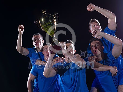 soccer players team group celebrating the victory and become champion of game while holding win coup soccer players team group celebrating the victory and become champion of game while holding win coup