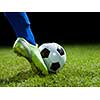 soccer player doing kick with ball on football stadium  field  isolated on black background