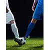 soccer player doing kick with ball on football stadium  field  isolated on black background