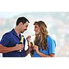 happy couple at big bright comfort apartment celebrate with glasses of champagne