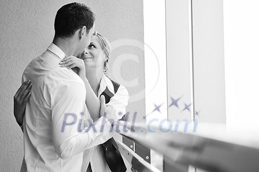 romantic happy couple relax and have fun at balcony in their new home apartment romantic happy couple relax and have fun at balcony in their new home apartment