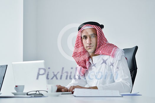 happy young arabic business man working at bright office happy young arabic business man working at bright office