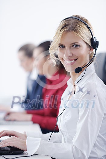 Pretty young business woman group with headphones smiling at you against white background Pretty young business woman group with headphones smiling at you against white background